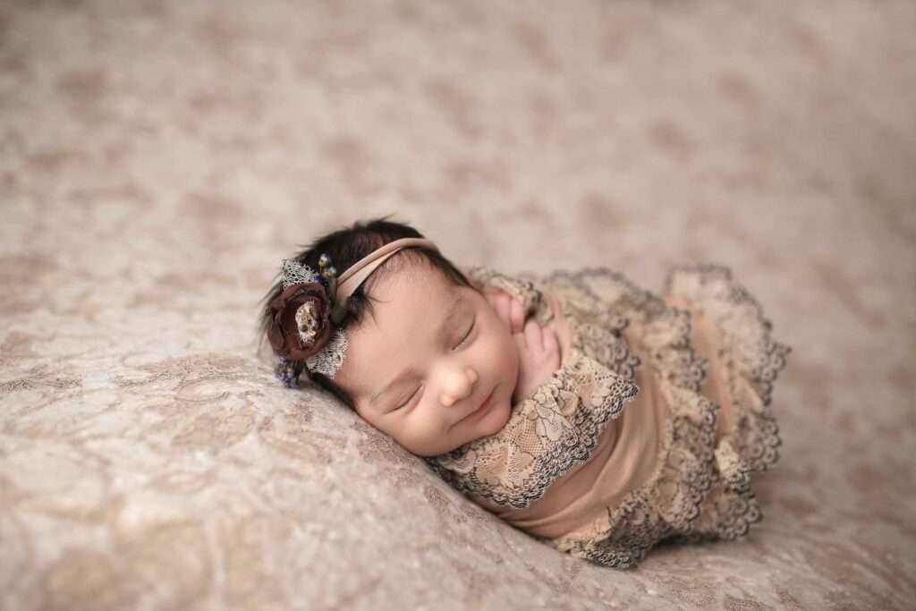 newborn baby girl smile