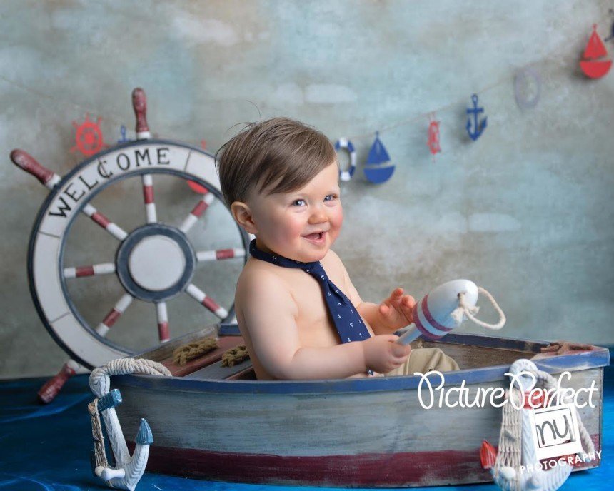 Nautical theme first Birthday boy in boat