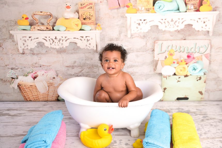 Ella enjoys a bath after her cake smash session!
