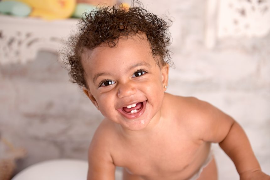 Ella laughs at the fun of her cake session!